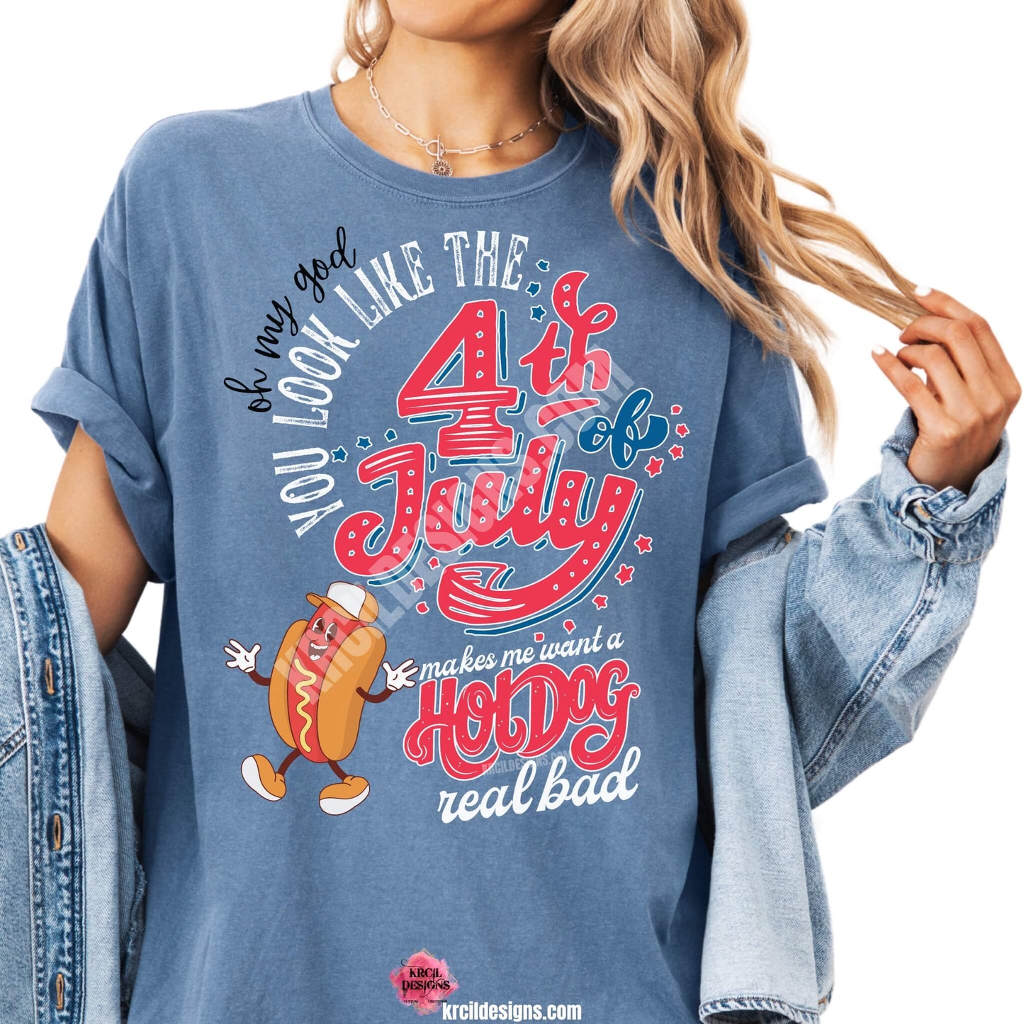 4th of July Funny Shirts by KrcilDesigns.com | Graphic design on a denim blue t-shirt, featuring a dancing smiling cartoon hot dog wearing sneakers, a baseball cap, and hands are waving. Colorful text in red, white, and blue colors, in a variety of fonts, text that reads: "Oh My God You Look Like The 4th of July Makes Me Want A Hot Dog Real Bad" Fun, festive, and perfect for Independence Day celebrations!