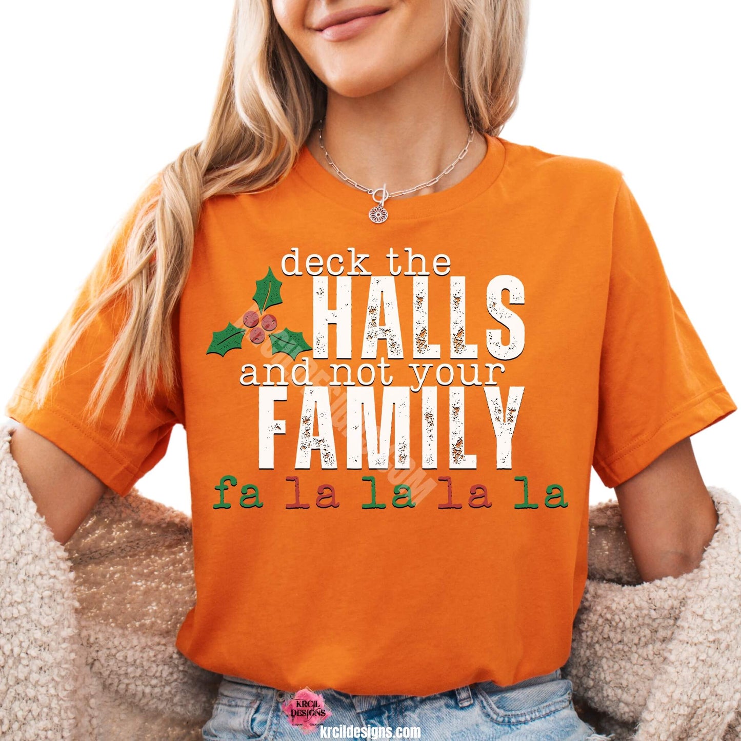 Vintage Distressed Deck The Halls and Not Your Family Christmas Tee by Krcil Designs | Make a fashion statement with our graphic tees t-shirts! Our buttery soft cozy tees will become your new weekend bestie! Dress to impress with clothes that have laugh-out-loud jokes—Introducing our "deck the HALLS and not your FAMILY falala" Funny Christmas Shirt. This holiday season, celebrate in style with Christmas t-shirts for family—perfect for family photos! Shop Christmas Tees at KrcilDesigns.com