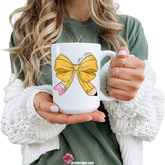 Coquette Bow Coffee Mugs by KrcilDesigns.com | Graphic design on a white ceramic mug, a coquette bow in a pencil pattern design, features your name, curved around top of bow in a black script font that reads: "Mrs. Name" for a teacher mug.