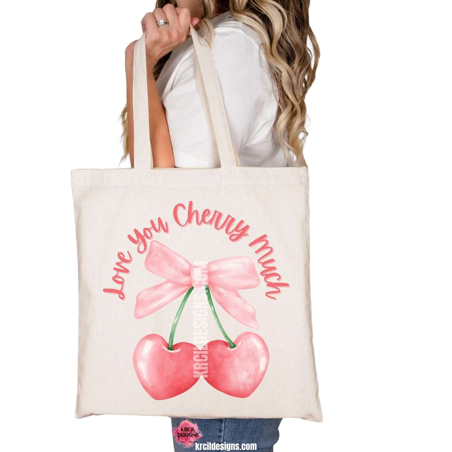 Coquette Bow Tote Bags by KrcilDesigns.com | Graphic design on a canvas tote bag, pink script font text that reads: "Love You Cherry Much" with a watercolor pink coquette bow and two pink cherry hearts dangling from bow.