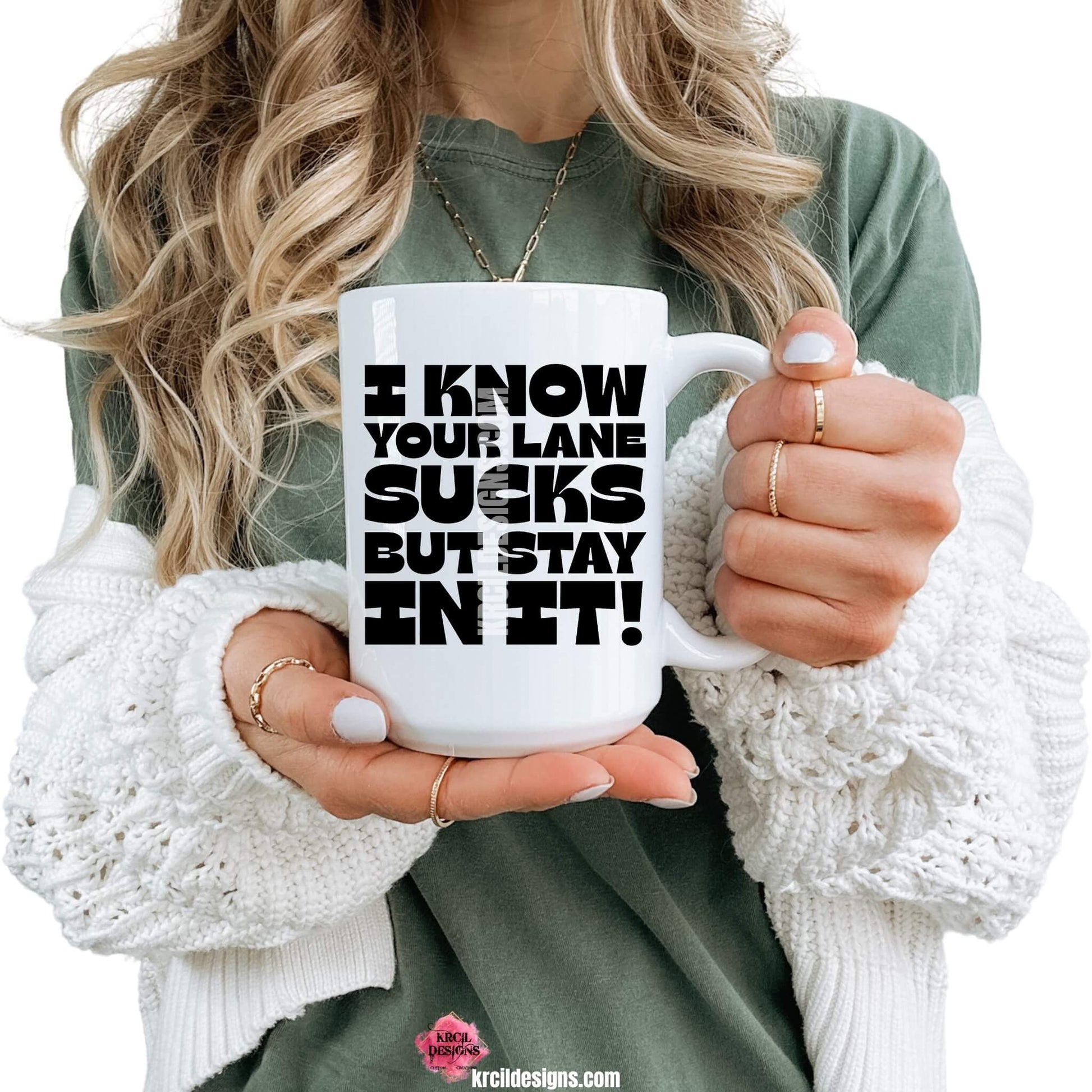 Sassy Funny Coffee Mugs by KrcilDesigns.com | Graphic design on a white ceramic mug, featuring bold black text that reads: "I Know Your Lane Sucks But Stay In It!"