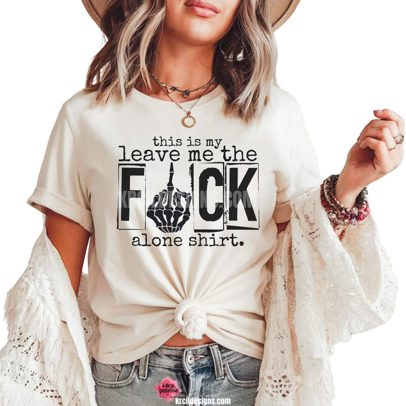 Sassy Graphic Tees T-Shirts by KrcilDesigns.com | Graphic design on a white t-shirt, featuring bold black text that reads: "this is my leave me the F*CK alone shirt."