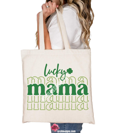 lucky mama Sassy St. Patrick's Day Tote Bag by Krcil Designs | Make a fashion statement with our tote bags! Meet our shopper bags—your new sidekick! You know, the ones that always tag along and never lets you down—it's about to become your favorite fashion accessory! Perfect for grocery shopping or errands. Our graphics showcases two colors of green, lucky in handwriting, mama in center is bold and outlined in a strobe like pattern. Shop Tote Bags at KrcilDesigns.com