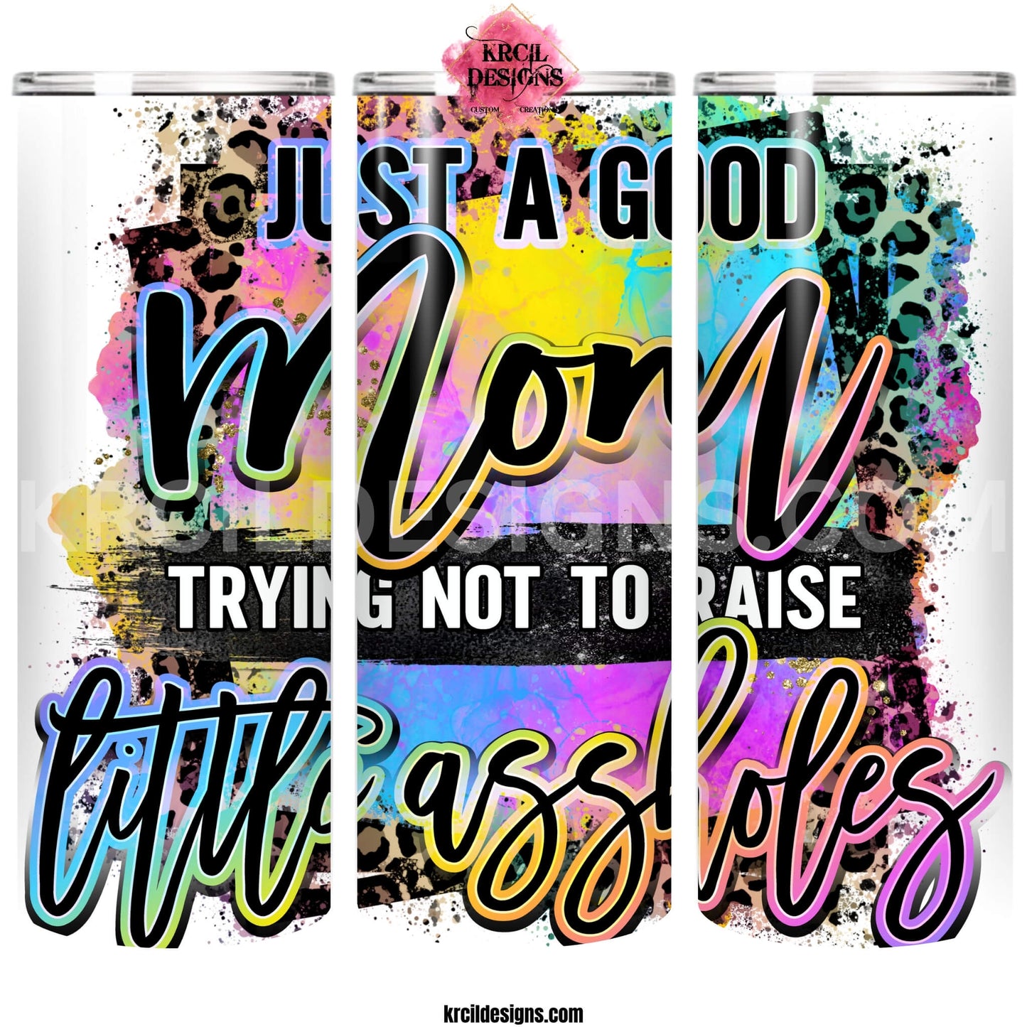 Sassy Mom Tumblers by KrcilDesigns.com | Graphic design on a white tumbler featuring bold, colorful text that reads "Just A Good Mom Trying Not To Raise Little Assholes" The word "Mom" is in a vibrant rainbow script with leopard print accents, and the background includes a splash of bright paint textures in yellow, teal, pink, and purple. The style is playful, edgy, and sassy—perfect for fun-loving moms with a sense of humor.