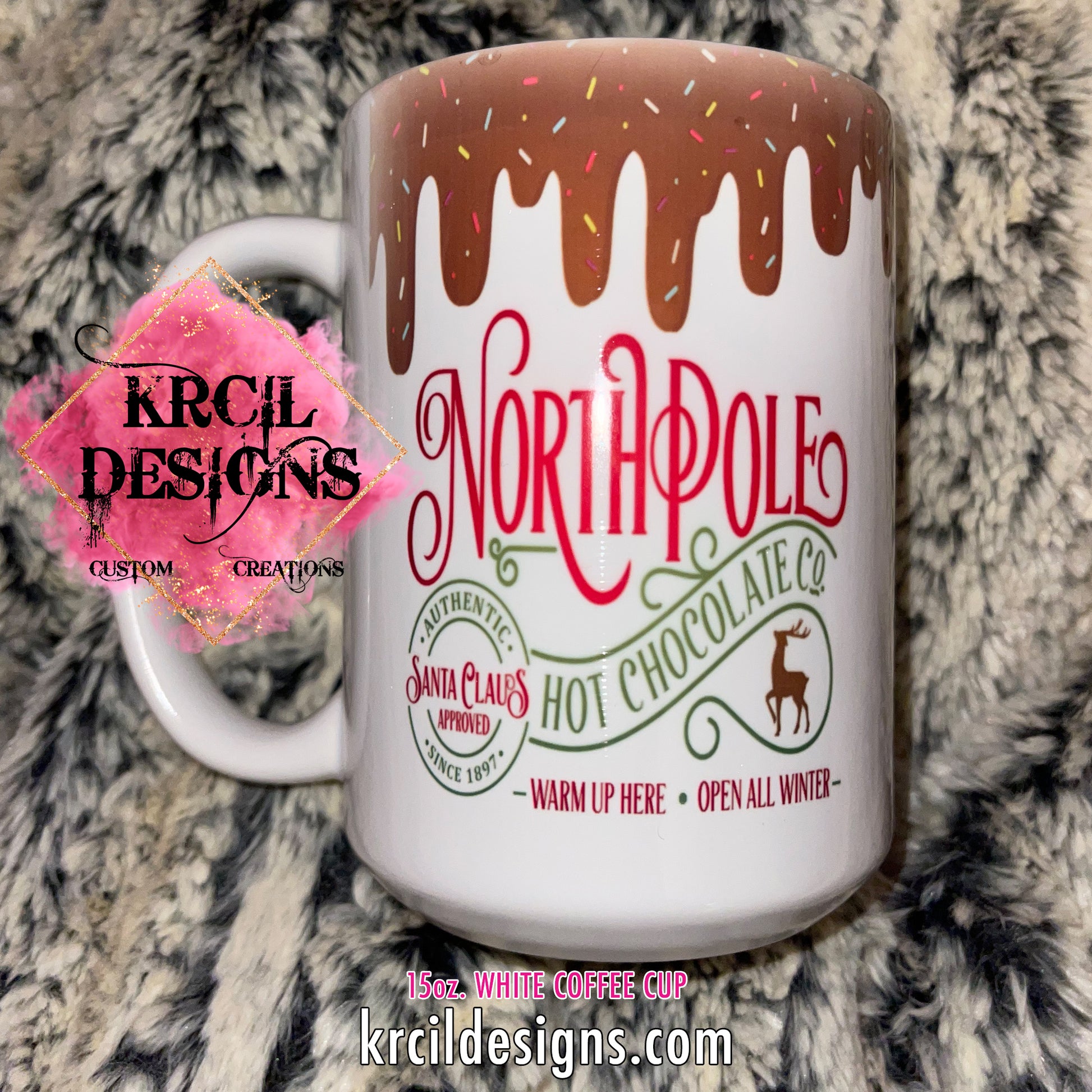 https://krcildesigns.com/cdn/shop/files/15oz-WHITE-COFFEE-CUP-NORTH-POLE-HOT-CHOCOLATE-krcildesigns.com.jpg?v=1699813378&width=1946