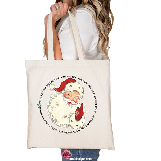 Vintage Santa Claus Is Coming To Town Christmas Tote Bag by Krcil Designs | Make a fashion statement with our tote bags! Get in the festive spirit with our vintage Santa Claus and the iconic lyrics that are beautifully wrapped around a jolly Santa and adorned with holly and berries. This holiday season, celebrate in style with our Christmas tote bags! Use them as wrapping for Christmas gift bags! Stuff them full of goodies for the ultimate gift! Shop Tote Bags at KrcilDesigns.com