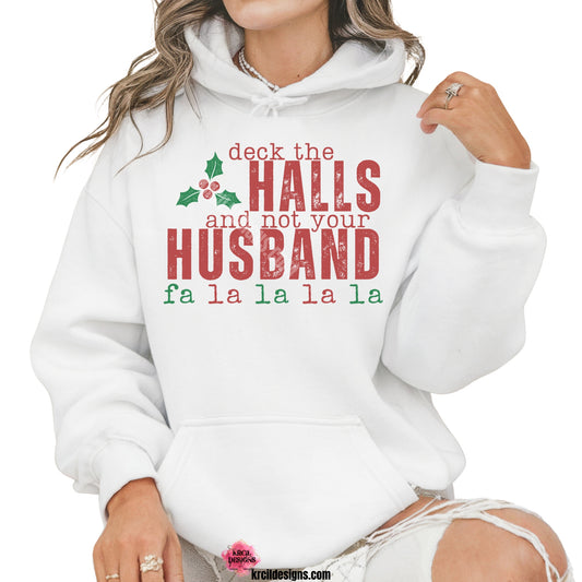 Vintage Distressed Deck The Halls and Not Your Husband Christmas Sweatshirt by Krcil Designs | Make a fashion statement with our hoodies and sweatshirts! Our soft cozy sweatshirts will become your new weekend bestie! Dress to impress with clothes that have laugh-out-loud jokes—Introducing our "deck the HALLS and not your HUSBAND fala" Funny Christmas Sweater. This holiday season, celebrate in style with Christmas shirts for family—perfect for family photos! Shop Christmas Sweaters at KrcilDesigns.com