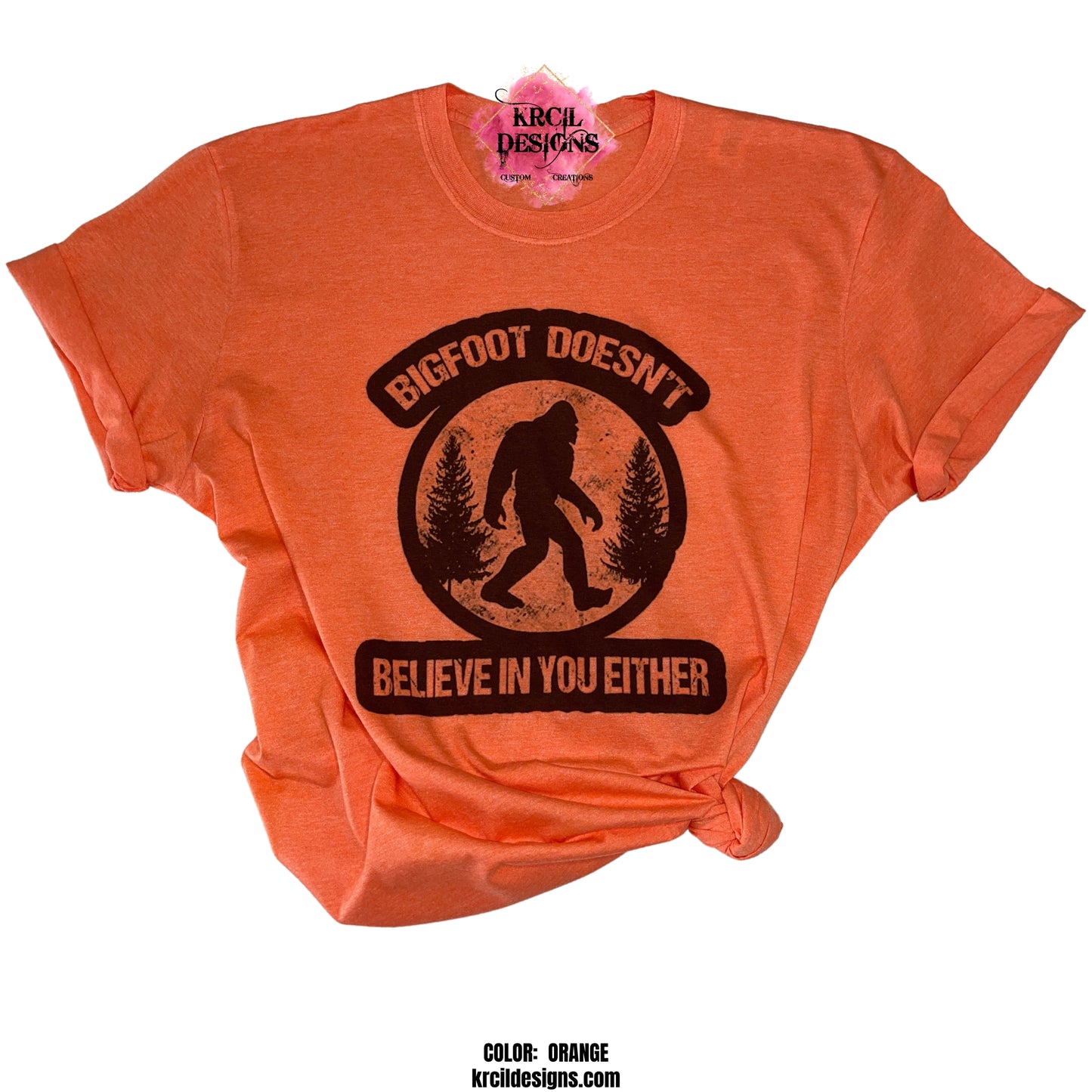 ORANGE | Show off your sense of humor with our Sasquatch T-Shirt "Bigfoot Doesn't Believe In You Either" Bigfoot T-Shirt by Krcil Designs! Featuring Bigfoot! The Bigfoot Tee that's a conversation starter at the Bigfoot Festival or on Bigfoot Day. Don't miss the fun — grab your Sasquatch Tee before it disappears into the woods! Give the gifts for Bigfoot lovers that make them roar with laughter! Keep the Bigfoot Legend Alive! Sasquatch: The Legend of Bigfoot! Shop Bigfoot Gifts at KrcilDesigns.com