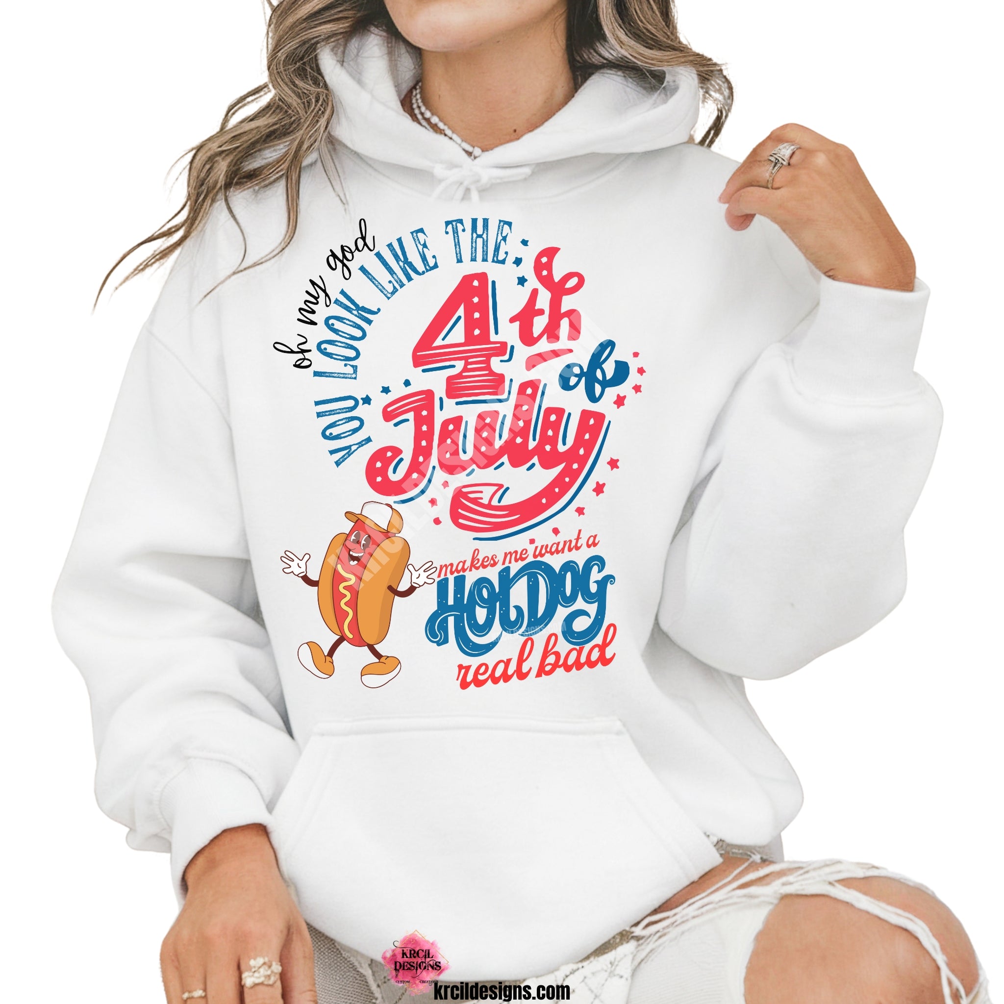 Oh My God You Look Like The 4th of July Makes Me Want A Hot Dog Real Bad Sweatshirt—Hoodie by Krcil Designs | Make a fashion statement with our hoodies and sweatshirts! Our buttery soft cozy sweatshirts will become your new weekend bestie! Introducing our funny sweatshirt made just for the 4th of July! Featuring the iconic quote, in a variety of fonts, in red, white, and blue colors, complete with a dancing hot dog. Shop Sweatshirts and Hoodies at KrcilDesigns.com