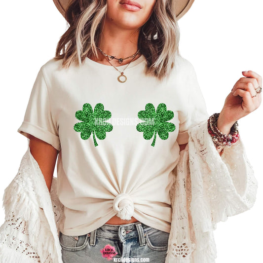 Shamrock Boobs St. Patrick's Day Funny Shirts by KrcilDesigns.com | Graphic design on a white t-shirt, speaking for itself, two green shamrocks are strategically placed—because nothing says luck like a little mischief and shamrocks over your boobs!