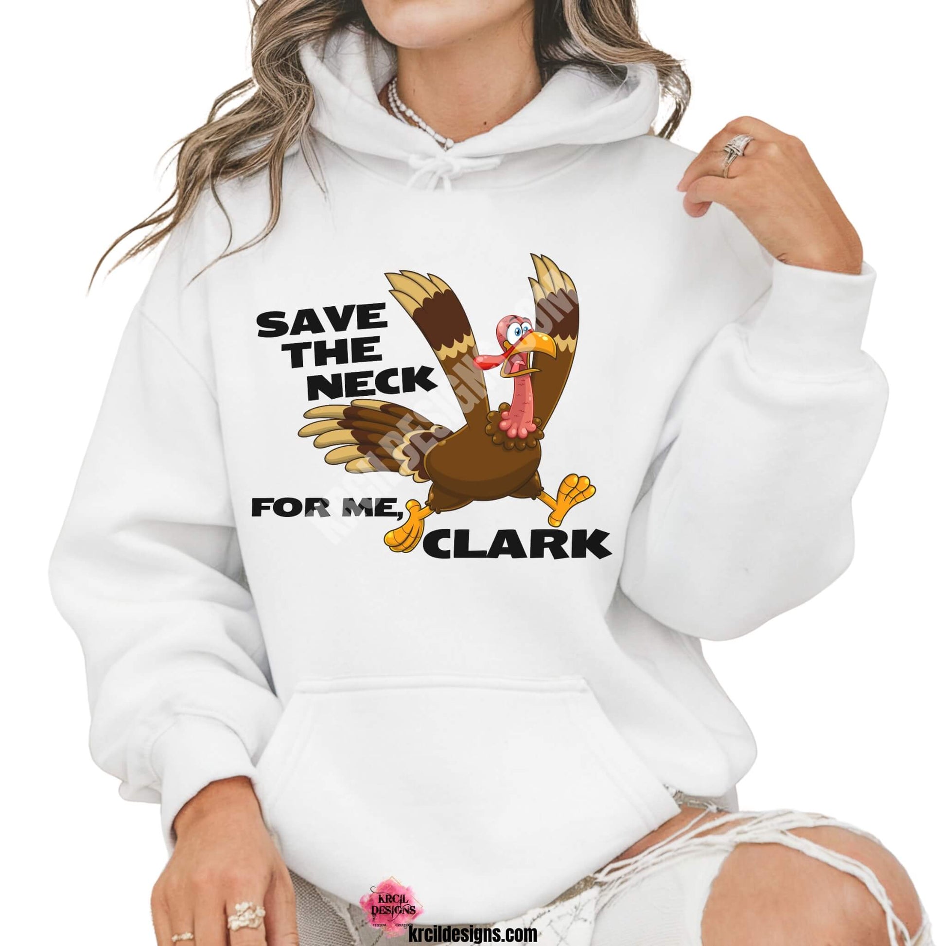 Funny Thanksgiving Shirts by KrcilDesigns.com | Graphic design on a white hoodie, featuring a cartoon turkey running with a panicked expression, wings flapping, and text that reads: "Save The Neck For Me, Clark" in bold black letters.