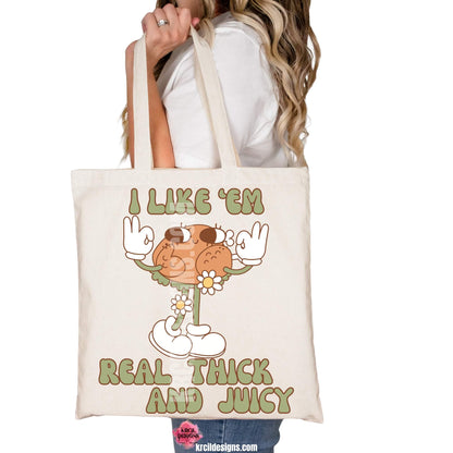 Thanksgiving Funny Tote Bags by KrcilDesigns.com | Graphic design on a canvas tote bag, featuring a playful cartoon turkey leg retro character with arms, legs, sunglasses, and daisy flowers, striking a sassy pose with both hands making the 'okay' sign. Surrounded by retro-style sage green text in all caps that reads: "I LIKE ‘EM REAL THICK AND JUICY"