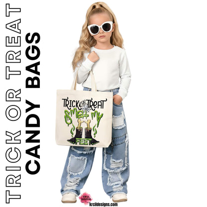 Monster Feet "Trick-or-Treat, Smell My Feet" Candy Bags Halloween Tote Bags by Krcil Designs | Unveiling our Monstrously Marvelous Monster, starring our quirky, hairy black monster feet boasting vibrant green toe nails and bones sticking out – because even monsters need some bone-chilling style while they hunt for candy! Personalize It - add name, initials, monogram, or special message. Durable, Reusable, Washable. Give the ultimate gift, add a cup, or t-shirt! Shop Candy Bags at KrcilDesigns.com