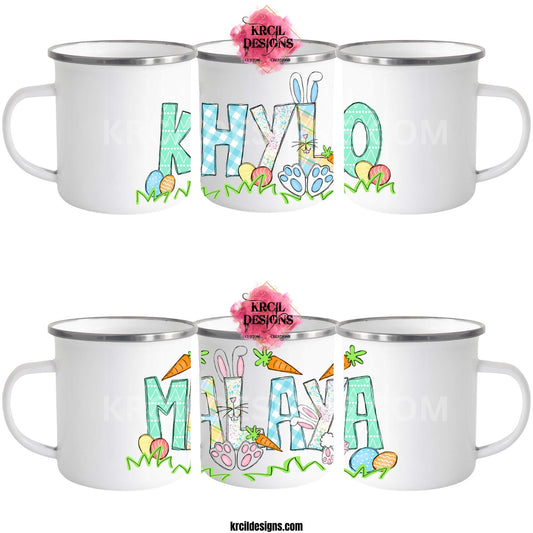 Easter Personalized Coffee Mugs by KrcilDesigns.com | Graphic design on white camp mugs, features your name, the letters are in different easter pastel patterns, one letter has a pink or blue Easter bunny character with bunny ears, bunny feet, and bunny tail, other letters have bunnies hop into them. Surrounding the letters are colorful Easter eggs, carrots, and the letters atop a row of grass. Add the kids names and make it truly yours!