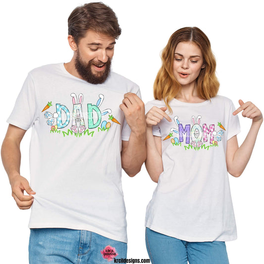 Easter Personalized Name Shirts by KrcilDesigns.com | Graphic design on white t-shirts, features your name, the letters are in different easter pastel patterns, one letter has a pink or blue Easter bunny character with bunny ears, bunny feet, and bunny tail, other letters have bunnies hopping into them. Surrounding the letters are colorful Easter eggs, carrots, and the letters atop a row of grass. Add the kids names and make it truly yours!