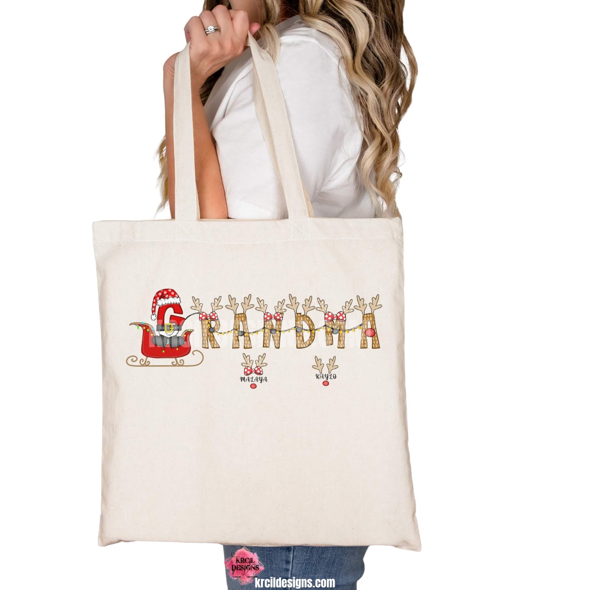 Christmas Personalized Tote Bags by KrcilDesigns.com | Graphic Design on a canvas tote bag, reads: "GRANDMA" stars a "G" that's gone full Santa mode, dressed up in Santa's Suit and Santa's Hat, riding in Santa's sleigh with twinkling Christmas lights, while the rest of the "Grandma" letters are transformed into Santa's Reindeer. Featuring reindeer antlers, bows, and Rudolph's Red Nose. Add grandkids names as little reindeer! Not just for Grandma, we have them for everyone!