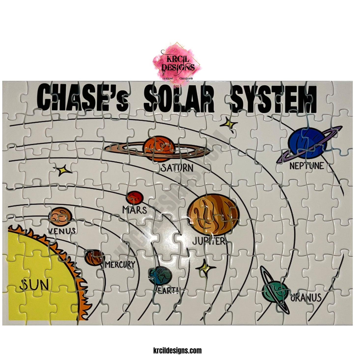 Your Name Solar System Personalized Puzzle by Krcil Designs | This planets puzzle is tailor-made for young children and it's a easy to complete with a white backdrop. Arrives fully assembled with an included reference picture. They'll explore the sun, the planets, and their names, all while having a blast. Learning about the solar system has never been this fun for the little ones, it's easy, educational, and fun - ignite their passion for space! Give the ultimate gift by adding a tote bag! KrcilDesigns.com