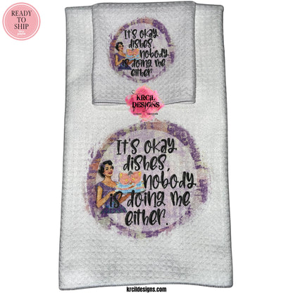 "It's okay dishes, nobody is doing me either." Retro Housewives Sets and Bundles by Krcil Designs | Step back in time with our retro housewives collection, complete with a sarcastic twist. You'll be cleaning up in true retro housewife style - with a smile, a laugh, and a whole lotta sass! Spice up your kitchen with our waffle weave dish cloth and dish towel sets, perfectly paired with our custom personalized coffee cups and mugs. Explore our sets and bundles options for gift ideas. KrcilDesigns.com