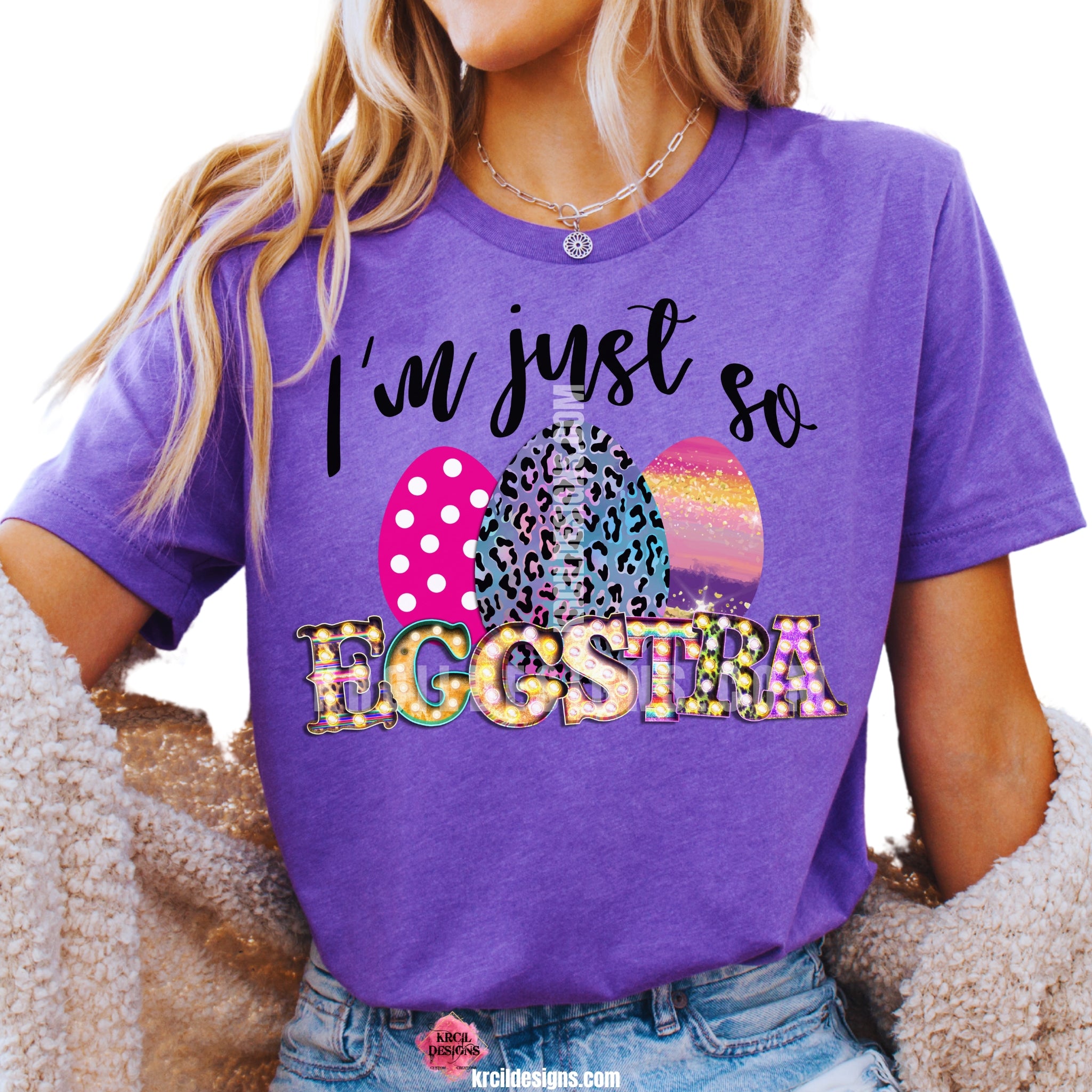 I'm just so EGGSTRA Easter T-Shirt by Krcil Designs | Make a fashion statement with our graphic tees t-shirts! Our buttery soft cozy tees will become your new weekend bestie! Get ready to hop into fun and show off your vibrant personality with our "I'm just so EGGSTRA" Easter shirt! Our graphic design, showcasing vibrant, bright, colorful Easter eggs and a fun, playful message. This Easter, celebrate in style with matching family shirts—perfect for family photos! Shop Easter Shirts at KrcilDesigns.com