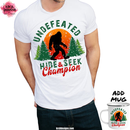 Sasquatch aka Bigfoot Tees "Undefeated Hide & Seek Champion" Custom T-Shirt by Krcil Designs | Design Your Own T-Shirt with Krcil Designs! | Custom T-Shirts, picture tees, photo t-shirts, sarcastic funny tees, special occasions, holidays and birthday t-shirts, bride-to-be bride tribe tees. Brand your business with our business logo t-shirts. Our unisex t-shirts are soft and cozy. For the ultimate gift, roll them up, stuff in a cup, or custom tote bag! KrcilDesigns.com