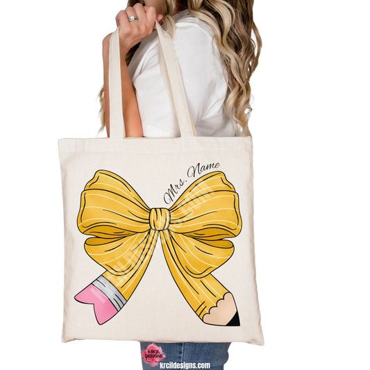 Coquette Pencil Bow Teacher Tote Bag with Name by Krcil Designs | Make a fashion statement with our tote bags! Perfect for running errands, getting groceries, carrying your teacher planner to school! Get schooled in style with our Teacher Tote Bag! Featuring your teachers name wrapped around a coquette bow in a pencil pattern, this Teacher Tote is the one you need! This Teacher's Day give a Teacher Gift that Teacher's Love! Shop Teacher Gifts at KrcilDesigns.com