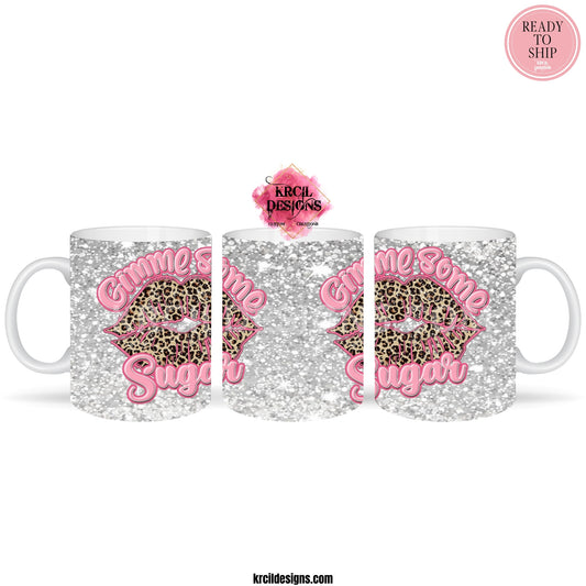 Valentines Mug | "Gimme Some Sugar" Valentines Coffee Cup by Krcil Designs | Indulge in your wild side with our fierce and fabulous cheetah print lips Valentine's Mug! This cute mug is perfect for the fashion-forward caffeine addict who likes to make a statement. The silver faux glitter background adds a touch of glamour, while the bold cheetah print lips make it clear that you mean business. Give a Valentine's gift that's Sugar-Tastic! KrcilDesigns.com