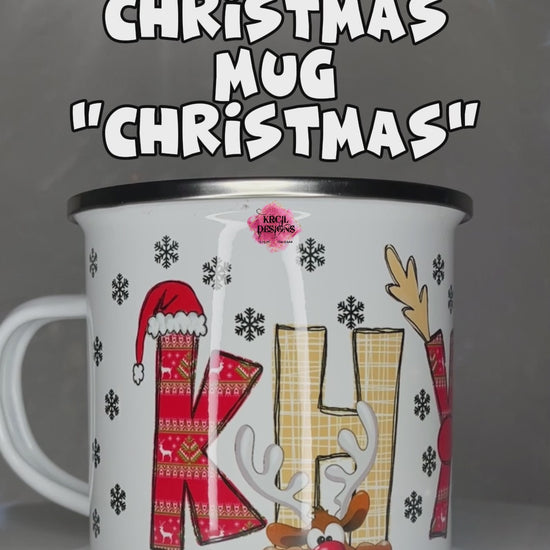 Personalized Christmas Mugs by KrcilDesigns.com | A video of our camp mug, graphic design features your name, in name style option: "Christmas" where the designs of the letters are different festive Christmas patterns. The letters don a Santa Hat, Rudolph's Red Nose, and Reindeer Antlers. Santa and his Reindeer are playing Peek-a-Boo and are peeking out of letters.