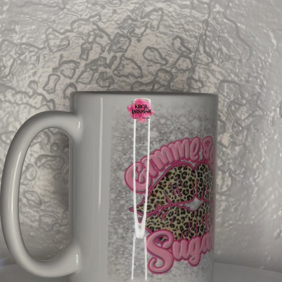 Valentines Mug | "Gimme Some Sugar" Valentines Coffee Cup by Krcil Designs | Indulge in your wild side with our fierce and fabulous cheetah print lips Valentine's Mug! This cute mug is perfect for the fashion-forward caffeine addict who likes to make a statement. The silver faux glitter background adds a touch of glamour, while the bold cheetah print lips make it clear that you mean business. This Valentine's Day give a Valentine's gift that's Sugar-Tastic! KrcilDesigns.com