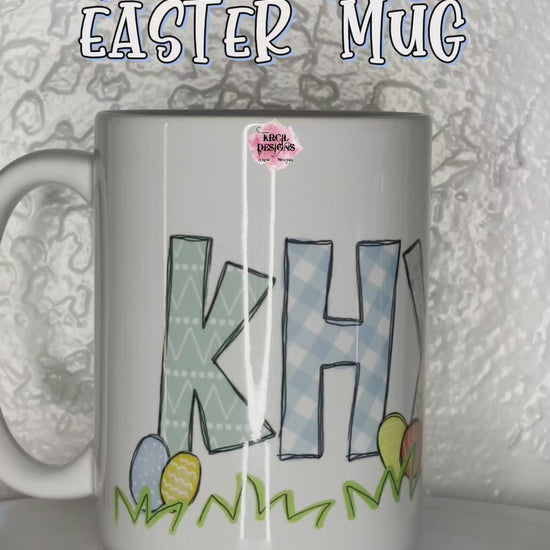 Your Name Easter Mug Personalized Coffee Cup by Krcil Designs | One lucky letter will be transformed into an Easter bunny, while playful bunnies hop into the other letters, letters are surrounded with colorful Easter eggs and carrots, and the joyful Easter letters. | Add a personalized Easter Basket with pink or blue bunny ears, personalized Easter Bunny with your name and year on ears, and a personalized Easter puzzle. We have all the personalized goodies this Easter! Hop Over to KrcilDesigns.com