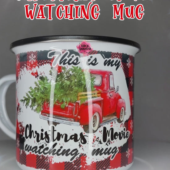 "This is my Christmas Movie Watching Mug" Personalized Metal Enamel Mug Christmas Coffee Cup by Krcil Designs | Imagine your kitchen transformed into a winter wonderland, complete with the iconic Christmas Red Truck, hauling a Christmas tree, its bed adorned with rustic wood railings. But that's not all – we're about to sprinkle a touch of personalization magic into your holiday season! Accessorize your kitchen with our sets and bundles and add personalization with your last name!  KrcilDesigns.com