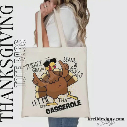 Thanksgiving Funny Tote Bags by KrcilDesigns.com | Graphic design on a canvas tote bag, featuring a cartoon turkey wearing sunglasses, the turkey is brown with a red wattle, yellow beak and feet, with yellow dots as a background. The words are scattered around the turkey in bold black text that reads: "Turkey Gravy Beans & Rolls LET ME SEE THAT CASSEROLE"