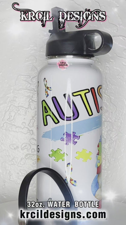 Autism Awareness Water Bottle by Krcil Designs | A gnome inspired water bottle that's perfect for spreading joy and promoting autism awareness. Featuring a colorful cheerful gnome wearing a puzzle-piece hat, surrounded by a cascade of puzzle pieces, and the autism puzzle-piece ribbon. | Let our custom water bottles do the talking with our collection of personalized water bottles. Personalize It - add name. Insulated stainless steel water bottles include 2 lids-wide mouth/flip top straw. KrcilDesigns.com