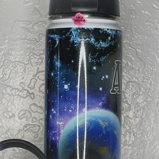 Explore the Stars | Galaxy Personalized Water Bottle by Krcil Designs | Get ready for an out-of-this-world universal masterpiece! With a cosmic pattern that'll leave you starstruck! | Let our custom water bottles do the talking with our collection of personalized water bottles. Personalize It - add name, monogram. For the ultimate gift, add a t-shirt, or accessorize with a custom tote bag. Insulated stainless steel water bottles include 2 lids-wide mouth/flip top straw. KrcilDesigns.com