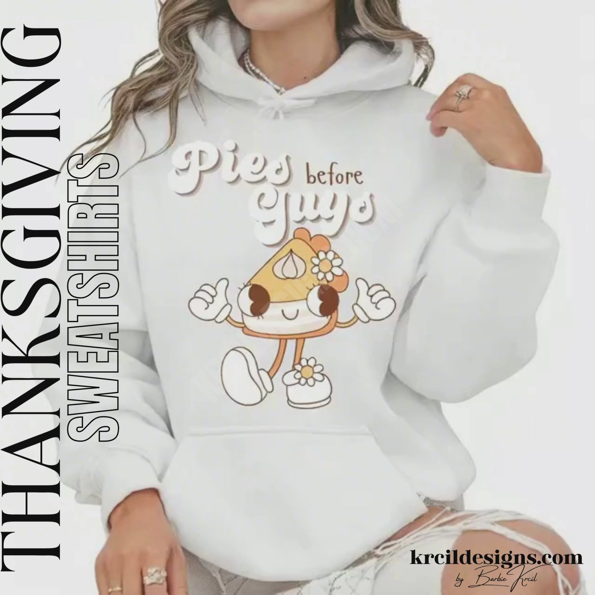 Funny Thanksgiving Shirts by KrcilDesigns.com | Graphic design on a white hoodie, featuring a playful cartoon piece of pumpkin pie retro character with arms, legs, and daisy flowers, striking a sassy pose with both hands making the 'thumbs up' sign. Surrounded by retro-style white text that reads: "Pies before Guys"
