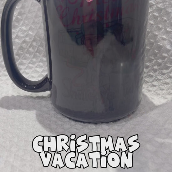 "Merry Christmas Shitter's Full" National Lampoon's Christmas Vacation Christmas Mugs Magic Mugs by Krcil Designs | Our Magic Mugs are black color change coffee cups, when you add hot liquid, they change from black to white, revealing your design, it’s like magic, and that’s why we named them our Magic Mugs. For the ultimate coffee lovers gift, add our dish cloths and dish towels sets, they pair perfect with our coffee mugs. Shop Coffee Mugs at KrcilDesigns.com