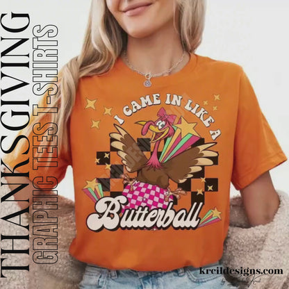 Funny Thanksgiving Shirts by KrcilDesigns.com | Graphic design on a orange t-shirt, featuring a cartoon turkey wearing sunglasses, the turkey is brown with a red wattle, yellow beak and feet, with yellow dots as a background. The words are scattered around the turkey in bold black text that reads: "Turkey Gravy Beans & Rolls LET ME SEE THAT CASSEROLE"