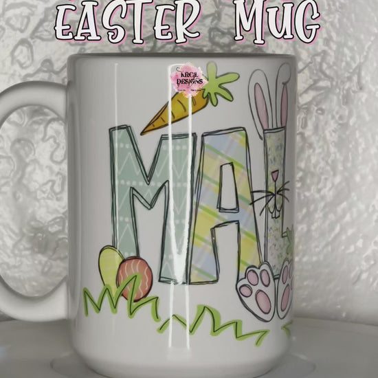 Your Name Easter Mug Personalized Coffee Cup by Krcil Designs | One lucky letter will be transformed into an Easter bunny, while playful bunnies hop into the other letters, letters are surrounded with colorful Easter eggs and carrots, and the joyful Easter letters. | Add a personalized Easter Basket with pink or blue bunny ears, personalized Easter Bunny with your name and year on ears, and a personalized Easter puzzle. We have all the personalized goodies this Easter! Hop Over to KrcilDesigns.com