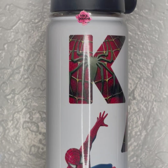 Spider-Man Personalized Water Bottle by Krcil Designs | Spider-Man fans, are you ready to "web" your thirst? We're here to save the day! Swing into hydration with your friendly neighborhood hero. | Let our custom water bottles do the talking with our collection of personalized water bottles. Personalize It - add name, monogram. For the ultimate gift, add a t-shirt, or accessorize with a custom tote bag. Insulated stainless steel water bottles include 2 lids-wide mouth/flip top straw. KrcilDesigns.com