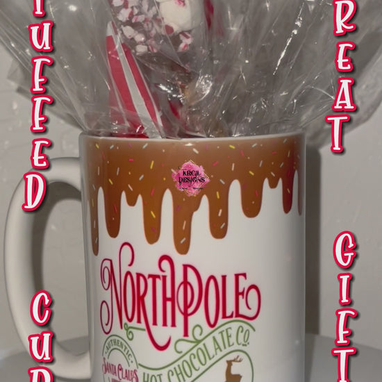 "Santa Claus Approved North Pole Hot Chocolate" Mug | Christmas Coffee Cup by Krcil Designs | Indulge in the magic of the season with each sip, you'll be transported to the enchanting North Pole and filled with holiday cheer. | Let our custom coffee cups do the talking with our collection of personalized coffee cups. Personalize It - add name. Add our dish cloth and tea towel set, perfectly paired with our cups and mugs. For the ultimate coffee lovers gift, explore our sets and bundles. KrcilDesigns.com