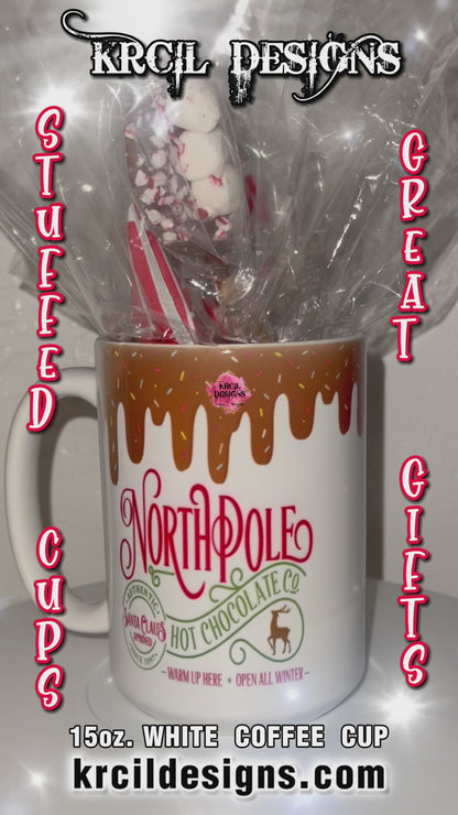 "Santa Claus Approved North Pole Hot Chocolate" Mug | Christmas Coffee Cup by Krcil Designs | Indulge in the magic of the season with each sip, you'll be transported to the enchanting North Pole and filled with holiday cheer. | Let our custom coffee cups do the talking with our collection of personalized coffee cups. Personalize It - add name. Add our dish cloth and tea towel set, perfectly paired with our cups and mugs. For the ultimate coffee lovers gift, explore our sets and bundles. KrcilDesigns.com